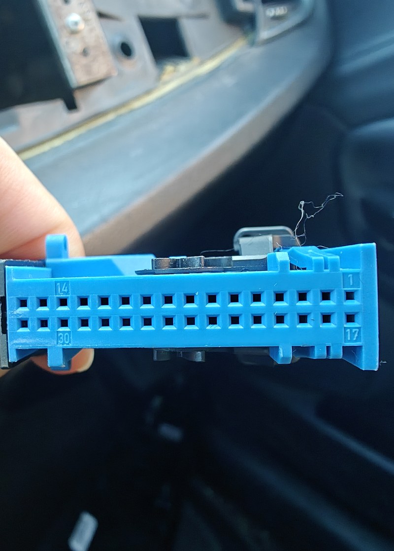 Blue female connector with visible corner numbers and latch landmarks.