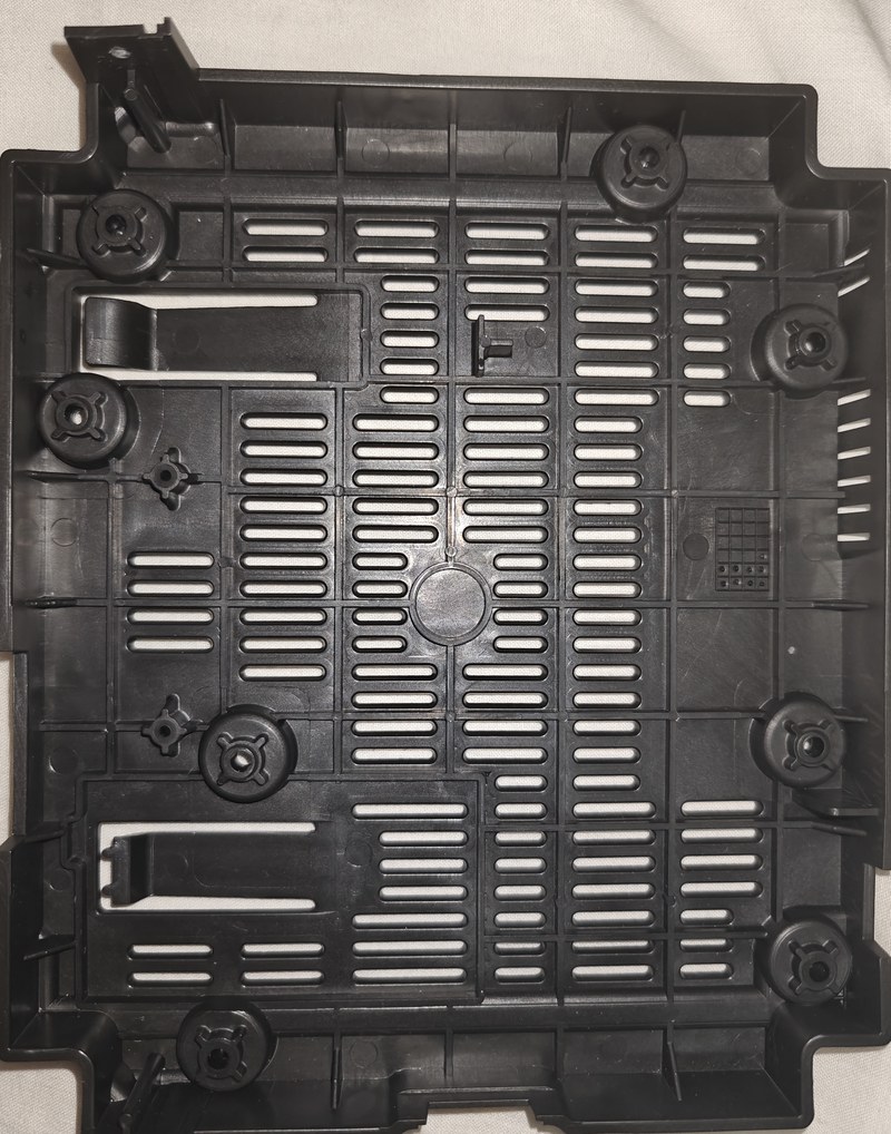 Empty housing with original posts and connector opening.