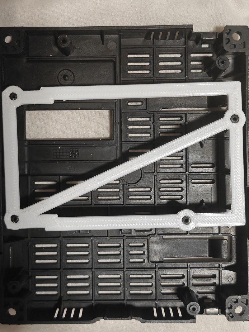 White printed frame fitted in the empty black housing.