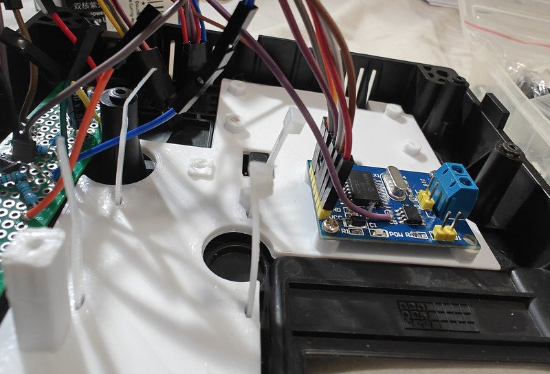 Wires and connector assembly seen from a low angle inside the housing.